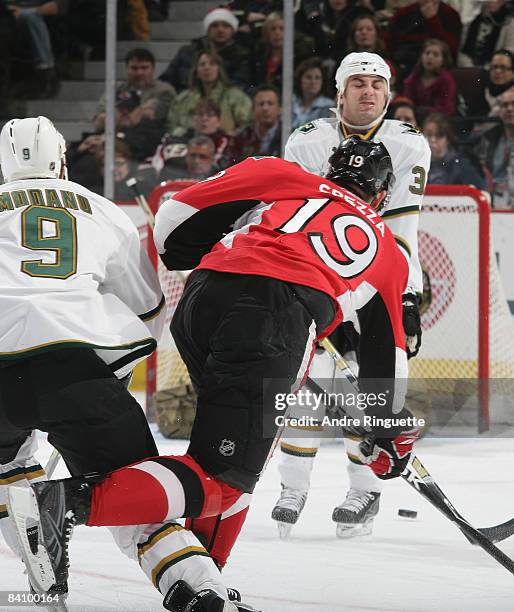 Doug Janik of the Dallas Stars winces as he stands in the way of a slapshot by Jason Spezza of the Ottawa Senators at Scotiabank Place on December...