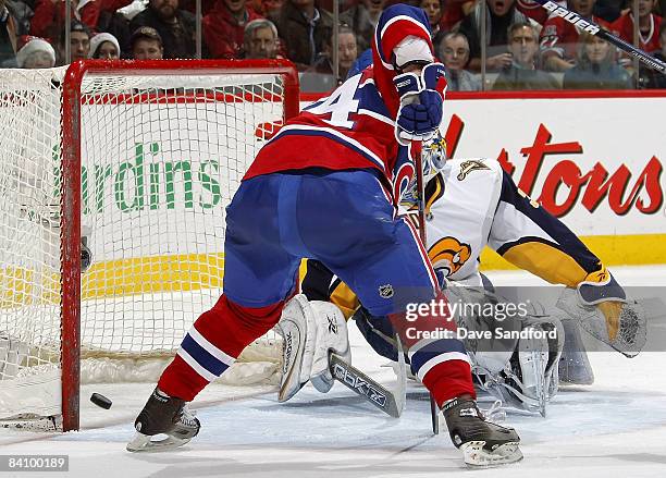 Ryan Miller of the Buffalo Sabres is beat by Sergei Kostitsyn of the Montreal Canadiens for the tying goal during their NHL game at the Bell Centre...