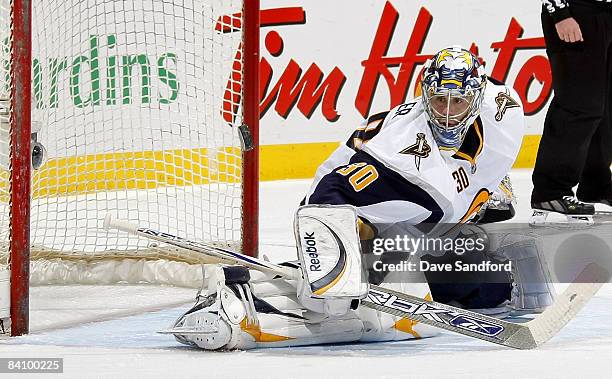 Ryan Miller of the Buffalo Sabres makes a blocker save against the Montreal Canadiens during their NHL game at the Bell Centre December 20, 2008 in...