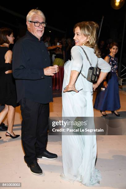 Ricky Tognazzi and Simona Izzo arrive at the dinner after the Opening Ceremony during the 74th Venice Film Festival at Excelsior Hotel on August 30,...