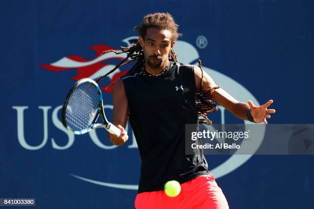 Dustin Brown of Germany returns a shot to Thomaz Bellucci of Brazil during their first round Men's Singles match on Day Three of the 2017 US Open at...