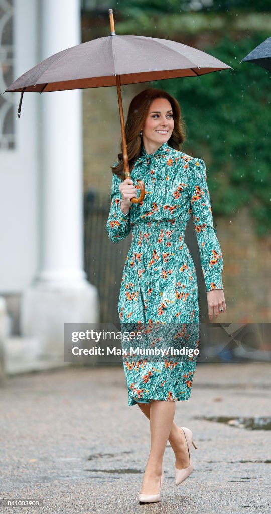 The Duke And Duchess Of Cambridge And Prince Harry Visit The White Garden In Kensington Palace