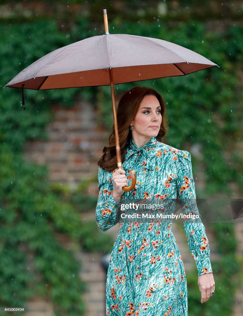 The Duke And Duchess Of Cambridge And Prince Harry Visit The White Garden In Kensington Palace