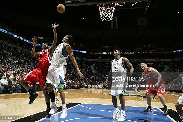 Kevin Ollie of the Minnesota Timberwolves guards against Aaron Brooks of the Houston Rockets during the game on December 20, 2008 at the Target...