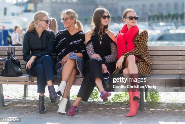 Guests sitting on a bench outside Whyred on August 30, 2017 in Stockholm, Sweden.