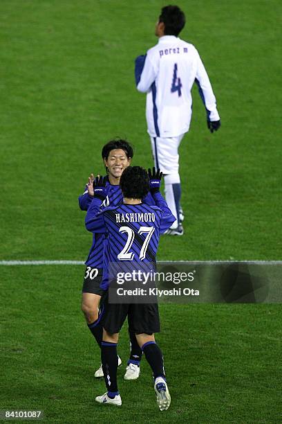 Masato Yamazaki and Hideo Hashimoto of Gamba Osaka celebrate their victory during the FIFA Club World Cup Japan 2008 third place match between...