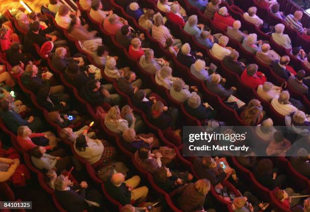 The audience watches as the production of the traditional pantomime Jack and the Beanstalk is shown on stage at the Theatre Royal Bath on December 20...