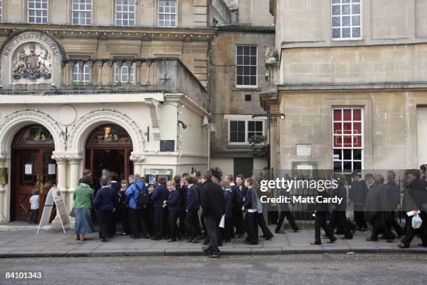 Children queue outside the box office as they wait for the production of the traditional pantomime Jack and the Beanstalk to shown on stage at the...