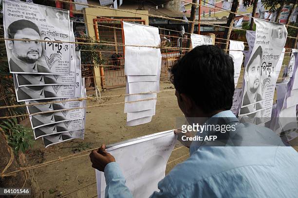 Bangladeshi political supporter prepares election campaign material in old Dhaka on December 21, 2008. A general election is scheduled to be held in...