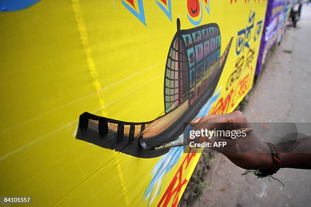 Bangladeshi artist paints a colourfull banner for forthcoming elections in old Dhaka on December 21, 2008. A general election is scheduled to be held...