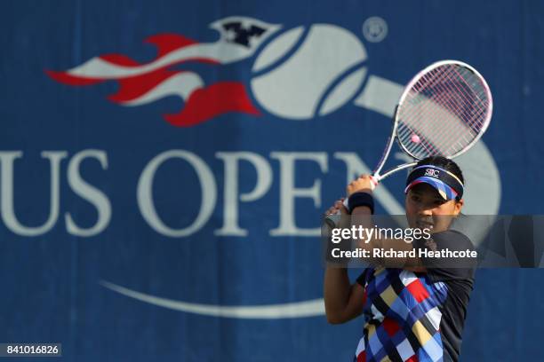 Risa Ozaki of Japan returns a shot against Danielle Lao of the United States during their first round Women's Singles match on Day Three of the 2017...