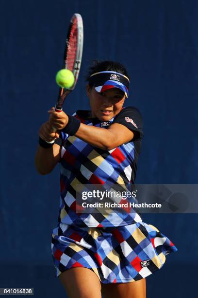 Risa Ozaki of Japan returns a shot against Danielle Lao of the United States during their first round Women's Singles match on Day Three of the 2017...