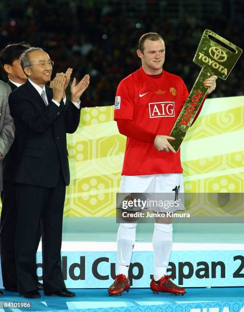 Katsuaki Watanabe, president of Toyota Motor Corporation and Wayne Rooney of Manchester United attend the award ceremony after the FIFA Club World...