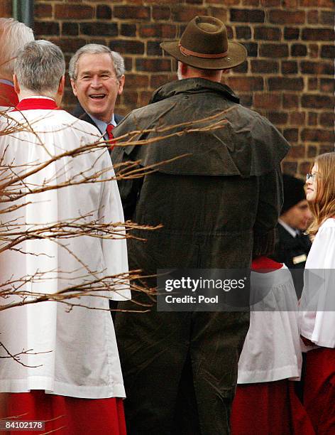 President George W. Bush greets members of the choir at Christ Church following Sunday morning services December 21, 2008 in Alexandria, Virginia....