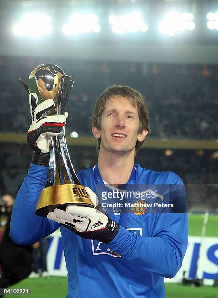 Edwin van der Sar of Manchester United poses with the FIFA World Club Cup after the FIFA World Club Cup Final match between LDU Quito and Manchester...