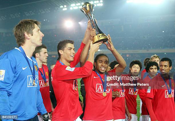 Cristiano Ronaldo and Anderson of Manchester United poses with the FIFA World Club Cup after the FIFA World Club Cup Final match between LDU Quito...