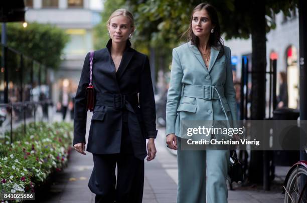 Tine Andrea and Darja Barannik wearing a pastel suit outside Rodebjer on August 30, 2017 in Stockholm, Sweden.