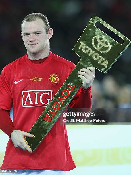 Wayne Rooney of Manchester United poses with his Man of the Match award after the FIFA World Club Cup Final match between LDU Quito and Manchester...
