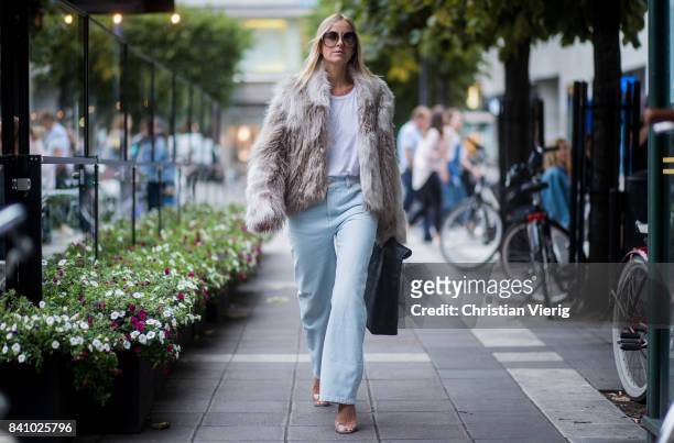 Celine Aagaard wearing a jacket, denim jeans outside Rodebjer on August 30, 2017 in Stockholm, Sweden.