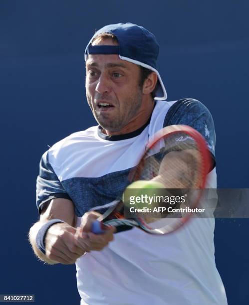 Paolo Lorenzi of Italy returns against Gilles Muller of Luxembourg during their 2017 US Open Tennis Tournament match on August 30, 2017 in New York....