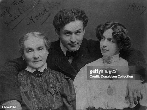 Harry Houdini, with his wife Beatrice and mother Cecilia Steiner Weiss, full-length portrait in circa 1907.