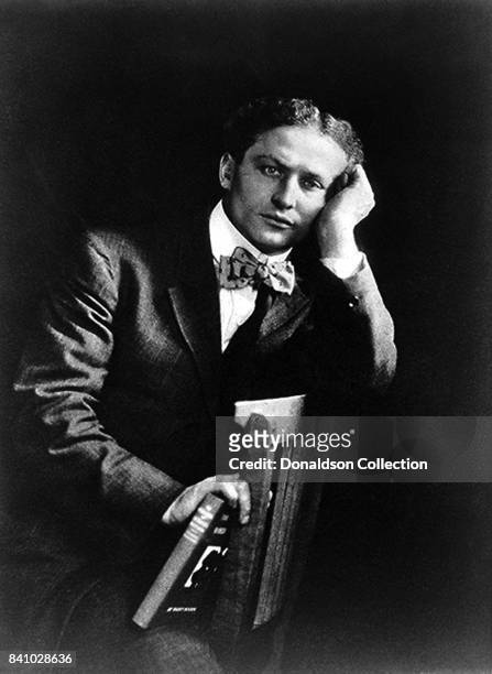 Magician Harry Houdini poes for a portrait in 1908.
