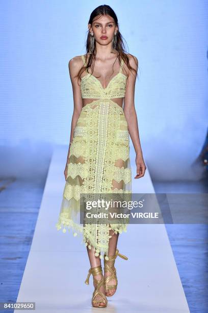 Model walks the runway during Fabiana Milazzo fashion show as part of Sao Paulo N44 Fashion Week Spring/Summer 2018 on August 28, 2017 in Sao Paulo,...