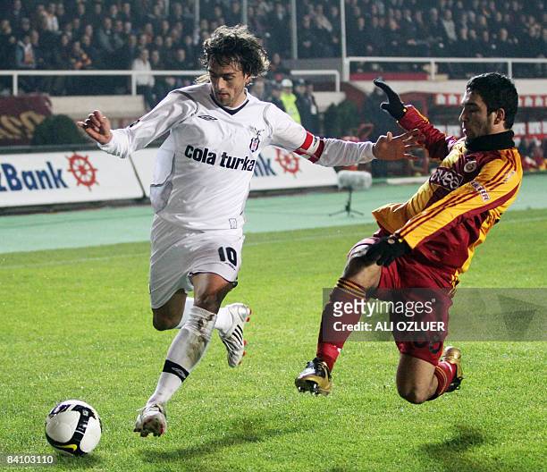 Arda Turan of Galatasaray vies for the ball with Matias Delgado of Besiktas during their Turkish Super League derby match at Ali Sami Yen Stadium in...
