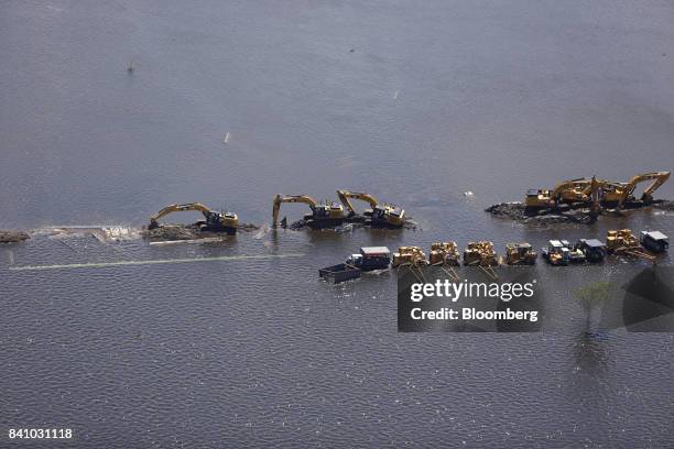 Caterpillar Inc. Construction equipment is seen immersed in floodwaters from Hurricane Harvey in this aerial photograph taken above West Columbia,...