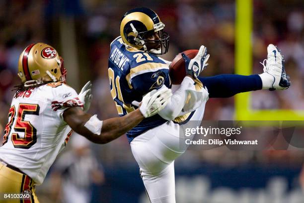 Oshiomogho Atogwe of the St. Louis Rams intercepts a pass intended for Vernon Davis of the San Francisco 49ers at the Edward Jones Dome on December...