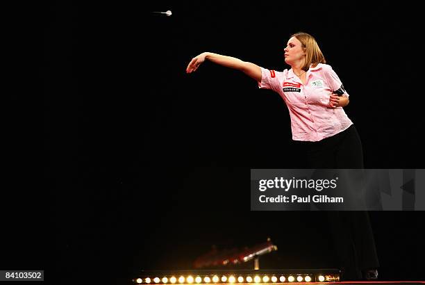 Anastasia Dobromyslova throws a dart during the first round match between Remco van Eijden of Netherlands and Anastasia Dobromyslova of Russia during...