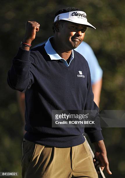 Vijay Singh of the Fiji Islands celebrates after he birdied on the 18th green to finish the tournament at 11 under par, in the final round of the...