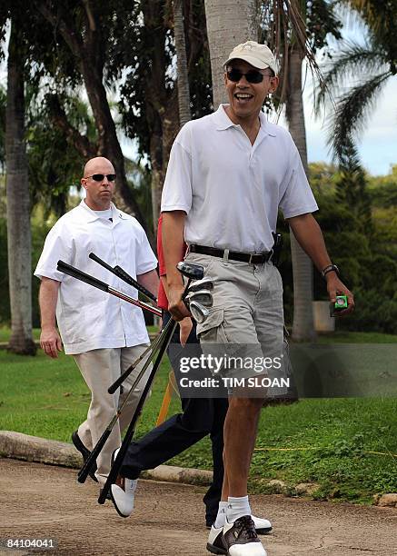 President-elect Barack Obama walks to the driving range before an afternoon round of golf December 21, 2008 near Kailua, Hawaii. Obama has boosted...