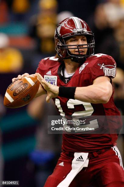 Quarterback Levi Brown of the Troy Trojans looks to throw a pass against the Southern Mississippi Golden Eagles in the R+L Carriers New Orleans Bowl...