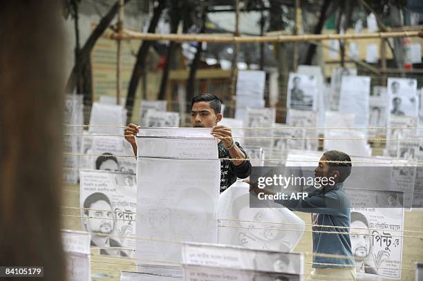 Bangladeshi political supporter prepares election campaign material in old Dhaka on December 21, 2008. A general election is scheduled to be held in...