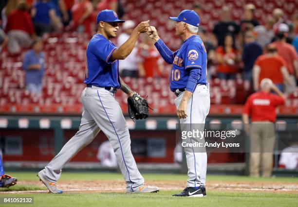 Ramos of the New York Mets celebrates with manager Terry Collins after the 2-0 win over the Cincinnati Reds at Great American Ball Park on August 30,...