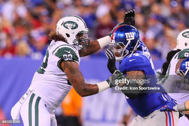 New York Jets nose tackle Leonard Williams battles New York Giants offensive tackle Ereck Flowers during the National Football League preseason game...