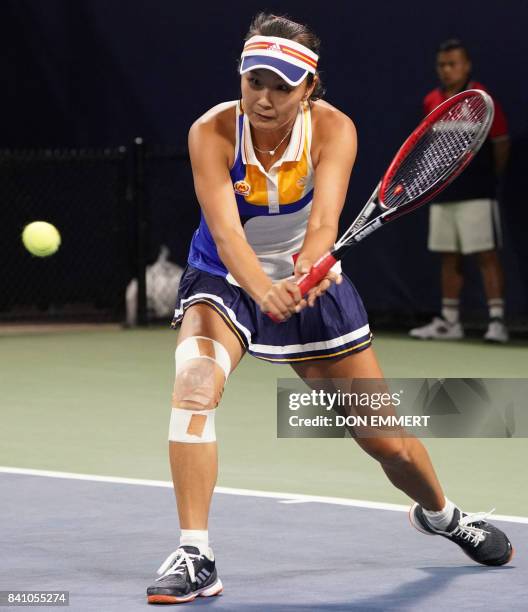 Peng Shuai of China hits a return to Donna Vekic of Croatia during their 2017 US Open Women's Singles match at the USTA Billie Jean King National...