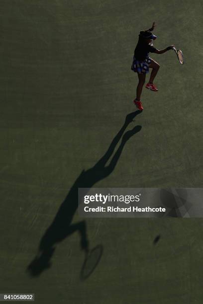 Risa Ozaki of Japan returns a shot against Danielle Lao of the United States during their first round Women's Singles match on Day Three of the 2017...