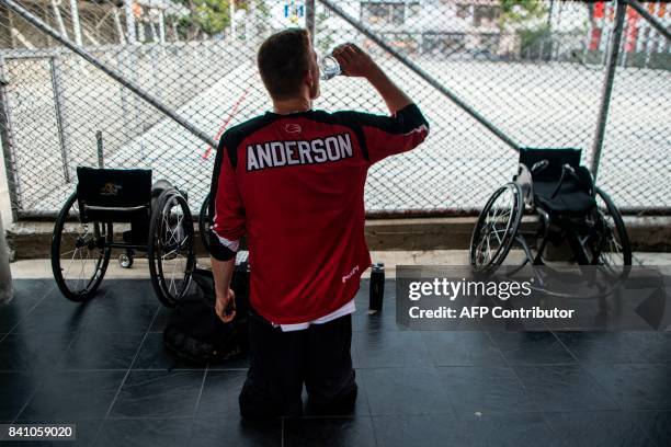 Canada team player Patrick Anderson, 38 drinks water while warming up ahead of the International Wheelchair Basketball Federation Men's Americas Cup...