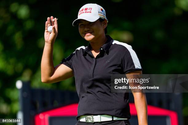 Yani Tseng waves to the crowd before teeing off on the 1st hole during the third round of the Canadian Pacific Women's Open on August 26, 2017 at The...