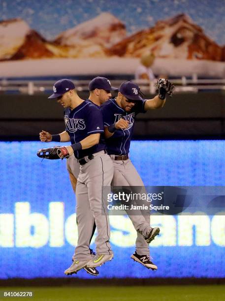 Corey Dickerson, Kevin Kiermaier and Peter Bourjos of the Tampa Bay Rays celebrate after the Rays defeated the Kansas City Royals 5-3 to win the game...