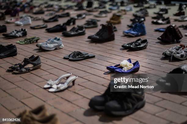 Shoes representing victims of suicide are seen on August 31, 2017 in Rotorua, New Zealand. The 606 pairs of shoes represent each person lost in 2016...