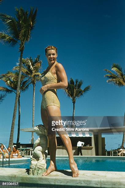 Swimmer and movie star Esther Williams by the pool in Florida, 1955.