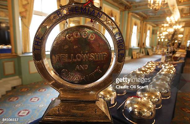 A dinner gong and a set of 16 silver plated cloches are pictured available for auction at the Cafe Royal on Regent Street on December 22, 2008 in...