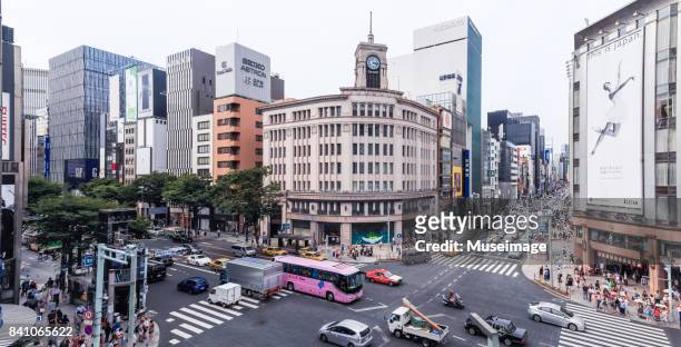 panorama view of the wako building of harumi-dori and chuo-dori streets in ginza, tokyo. - ginza stock pictures, royalty-free photos & images