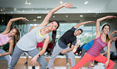 Happy people in an aerobics class at the gym