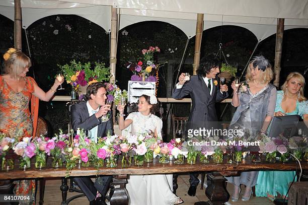 Leah Wood and Jack MacDonald with Jo Wood and Ronnie Wood attend their wedding reception dinner at HolmWood on June 21, 2008 in Kingston, London,...