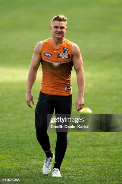 Ollie Wines of the Power looks on during a Port Power AFL training session at the Adelaide Oval on August 31, 2017 in Adelaide, Australia.