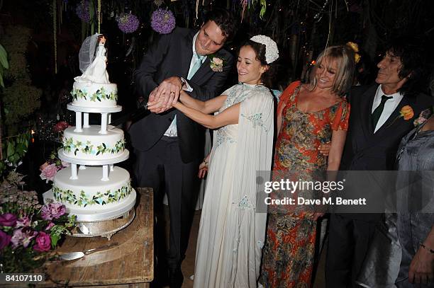 Leah Wood and Jack MacDonald with Jo and Ronnie Wood attend their wedding reception dinner at HolmWood on June 21, 2008 in Kingston, London, England.